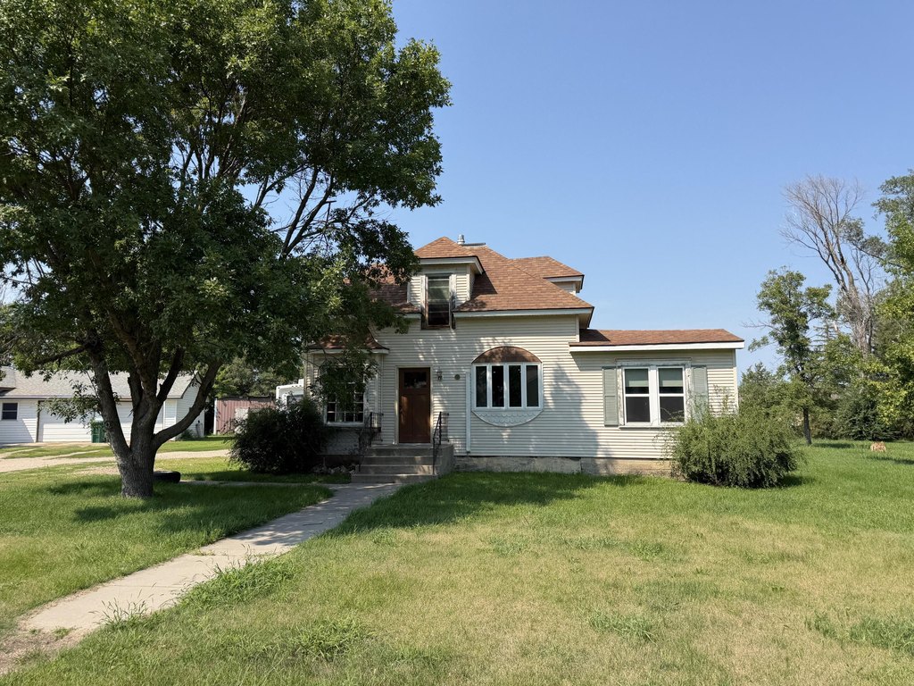 1888 Woonsocket House with Built-Ins, Bay Window, and Slide-Out Patio — $119,900