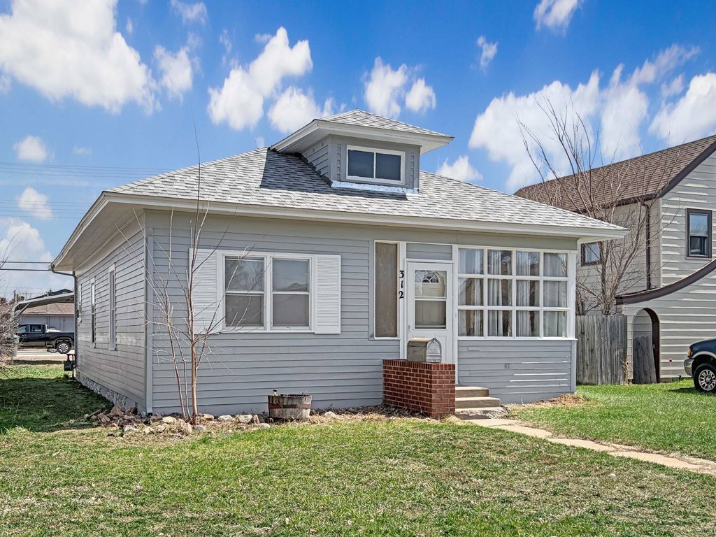 1906 Sidney Home with Original Hardwood Floors and Garage — $149,000