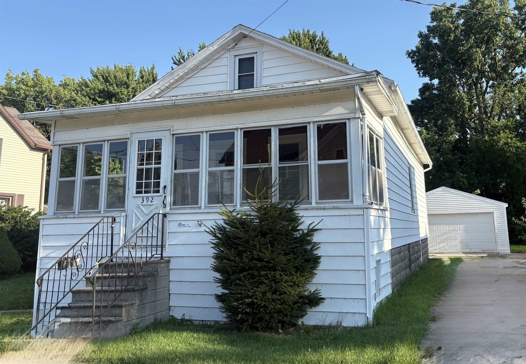 1880 Fond du Lac with Built-In Hutches, New Roof, and 2-Car Garage — $119,000