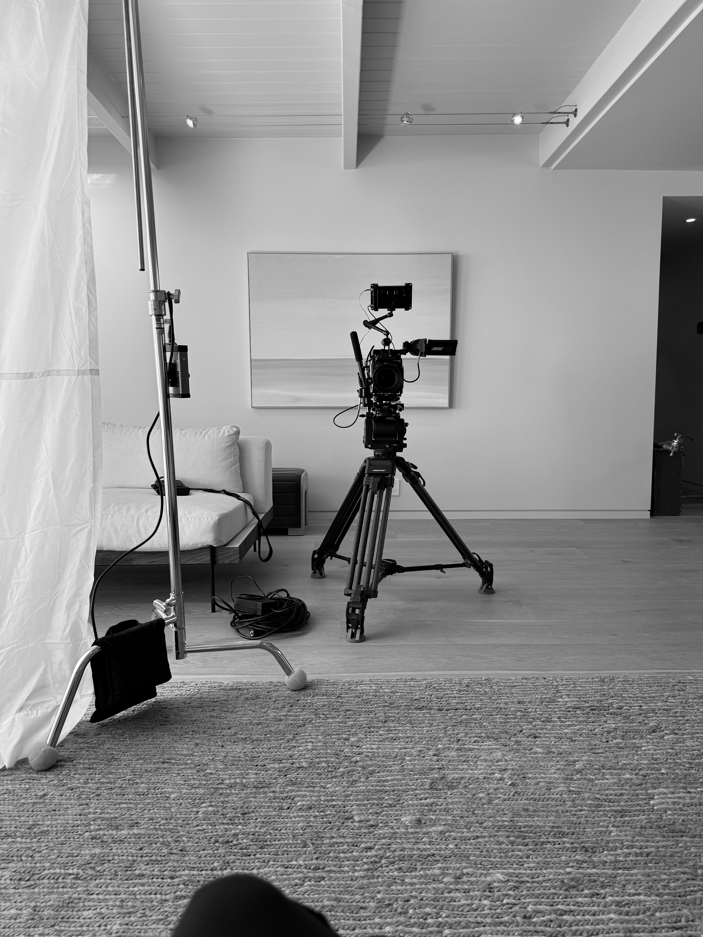 Camera on a tripod in a studio setup