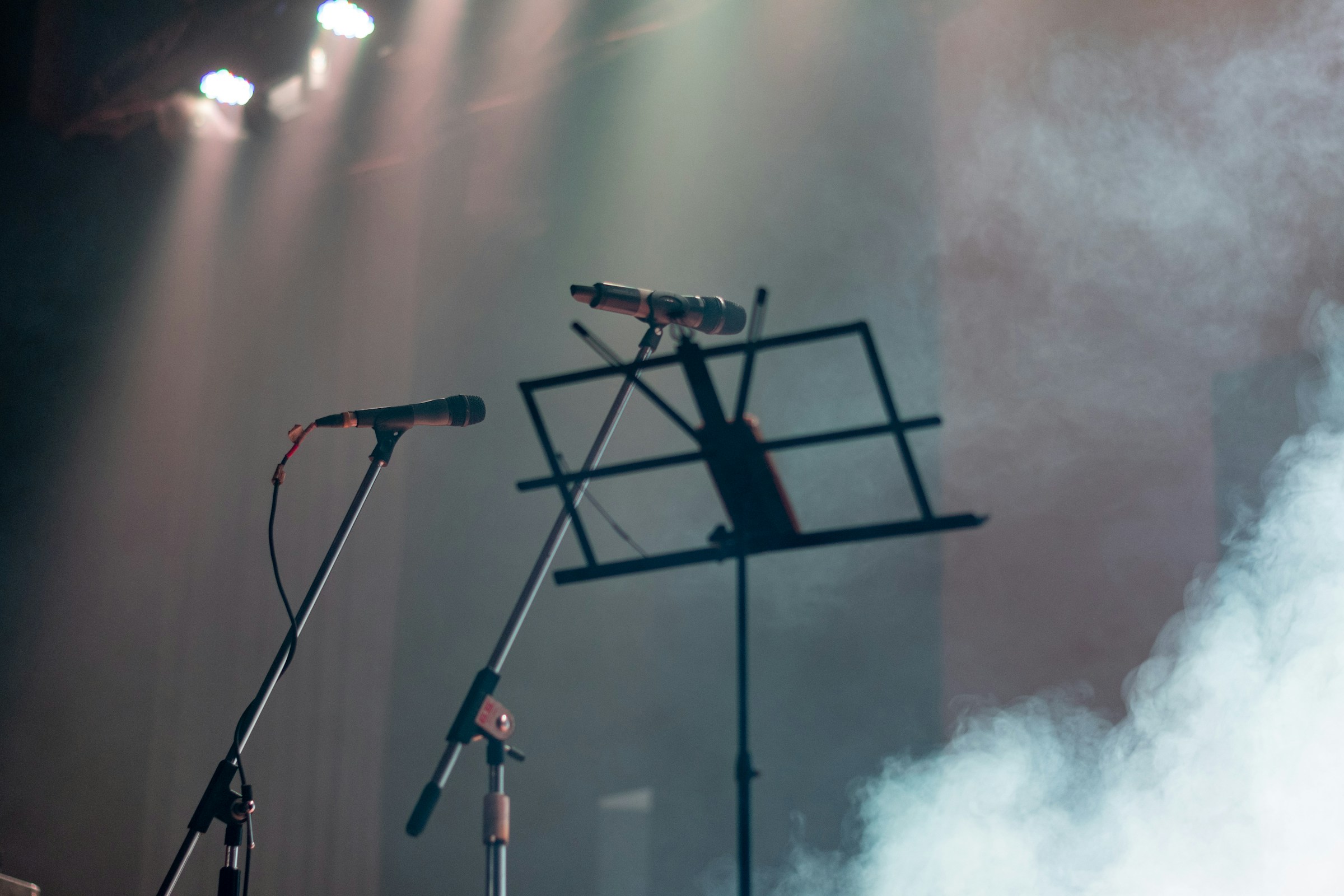 Microphone and keyboard on a lit stage
