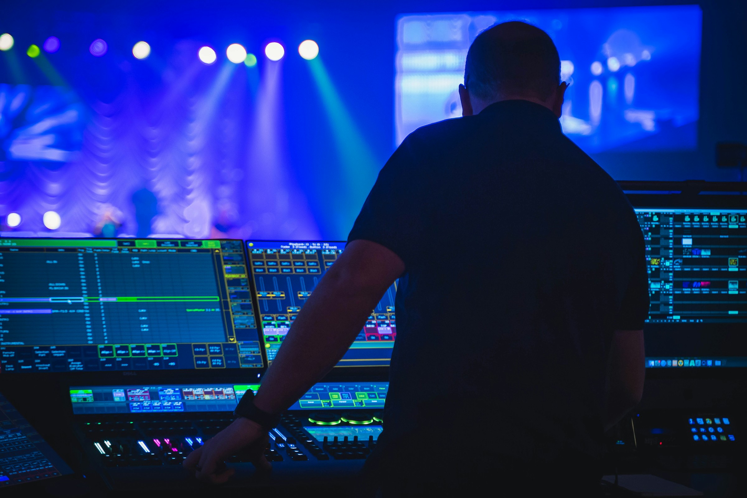 Sound engineer at a mixing console