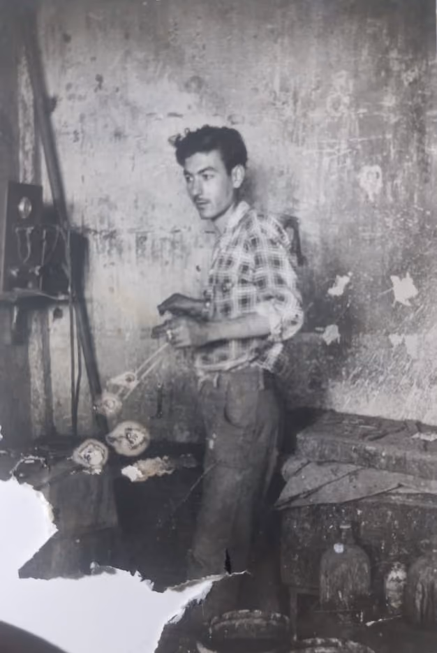 Historic photograph of Atelier S. Kasparianunder, [Yezegel Kasparian], working in the metal workshop with artisans, 1958