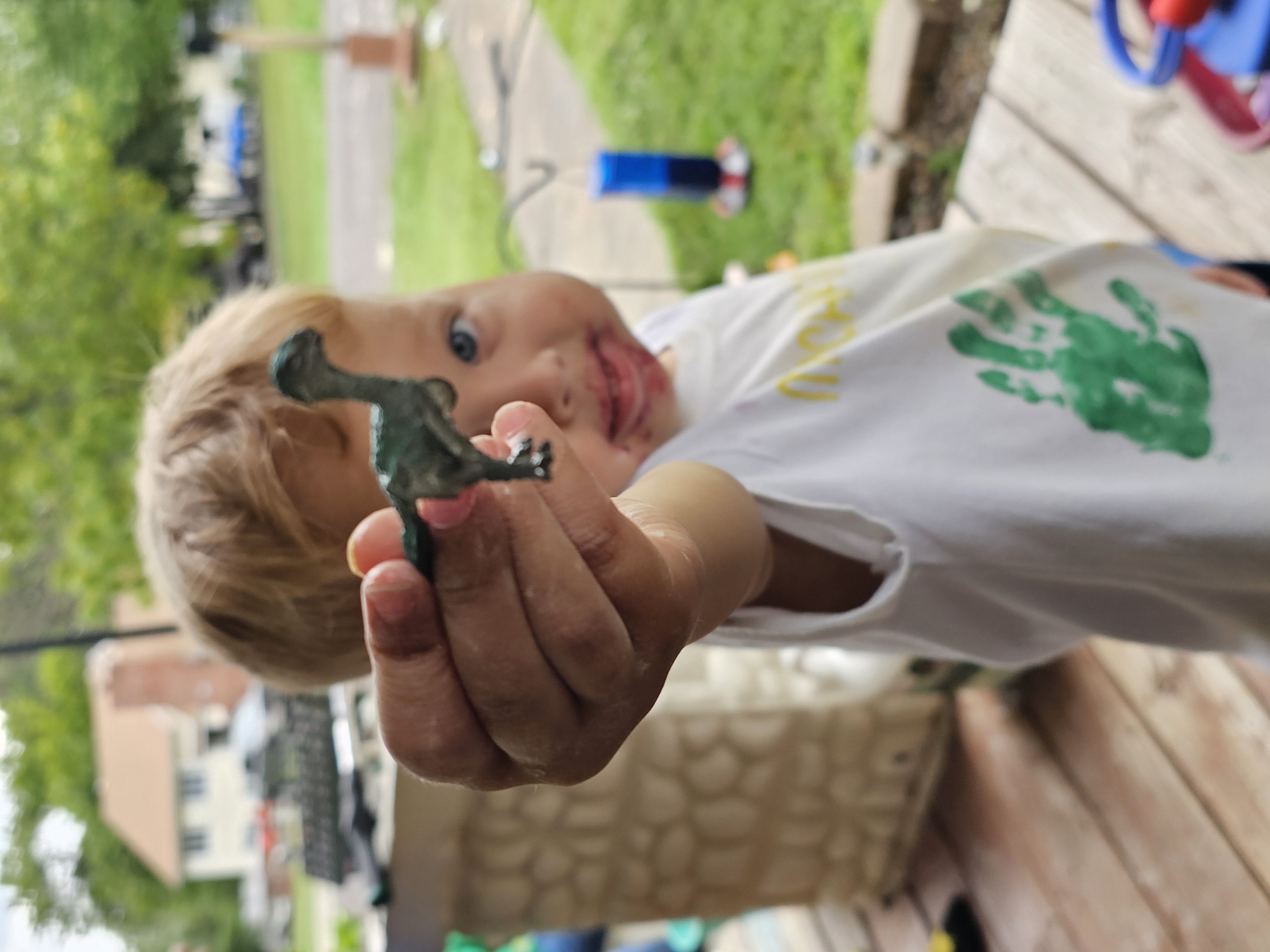 Luke holding a toy dinosaur