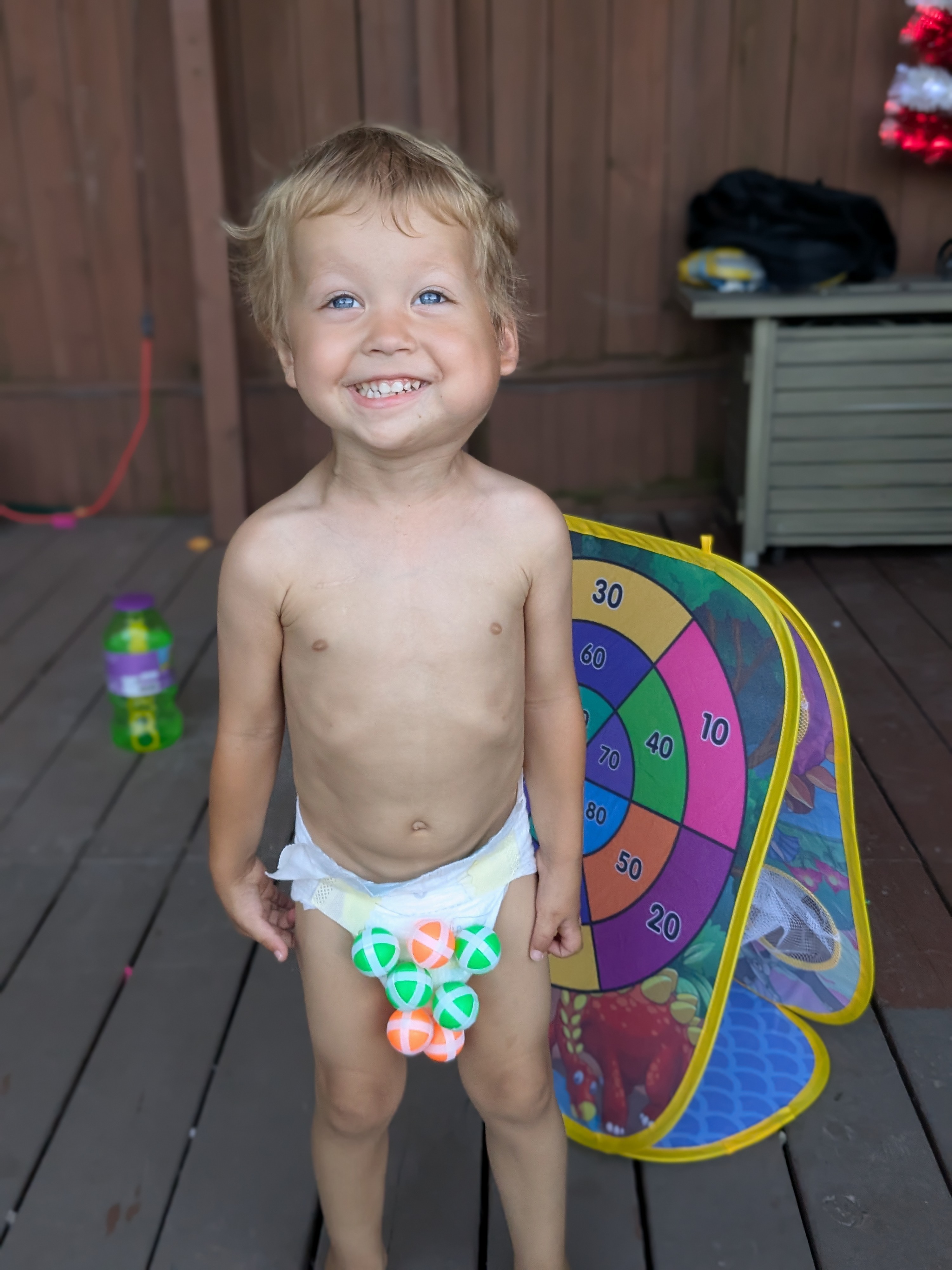 Luke playing outside on the deck