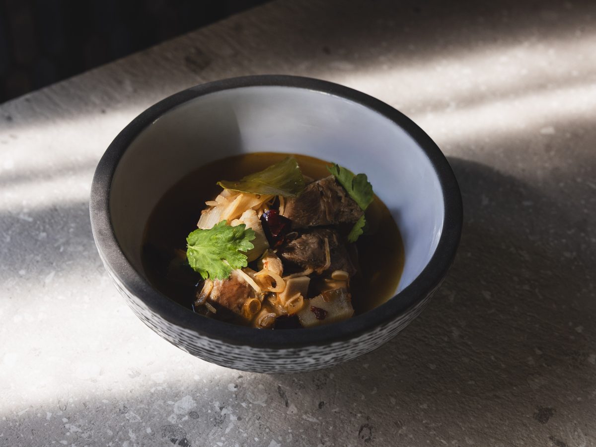 Spicy and sour pork cheek broth