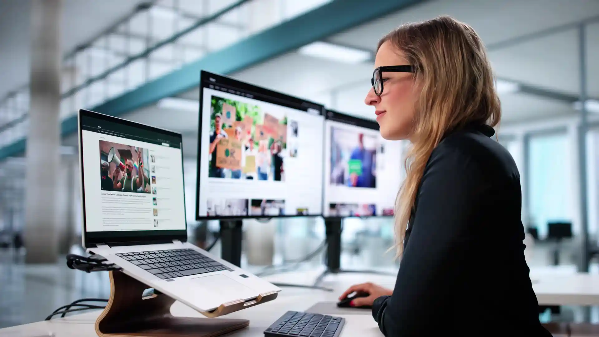 Marketing professional creating and publishing digital content across multiple screens.