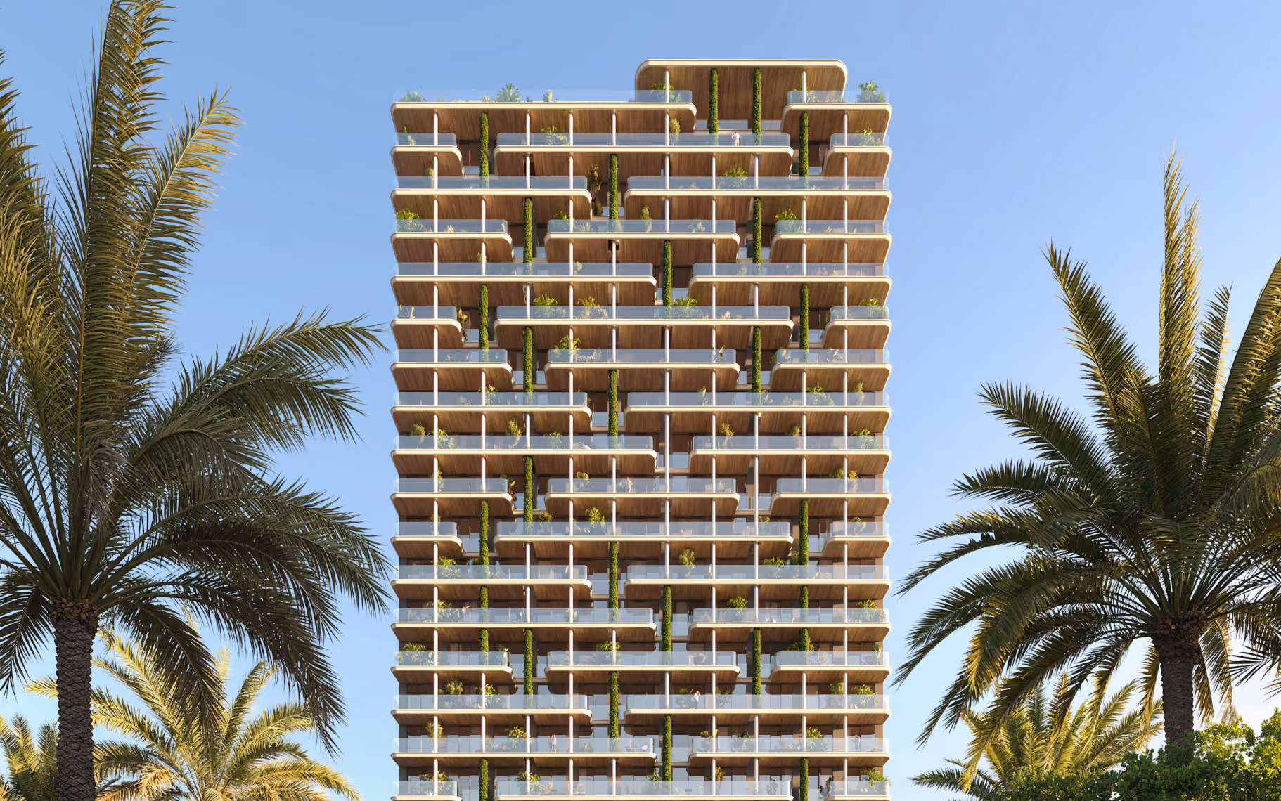 Modern multi-story building with large balconies and greenery, framed by palm trees and clear sky.
