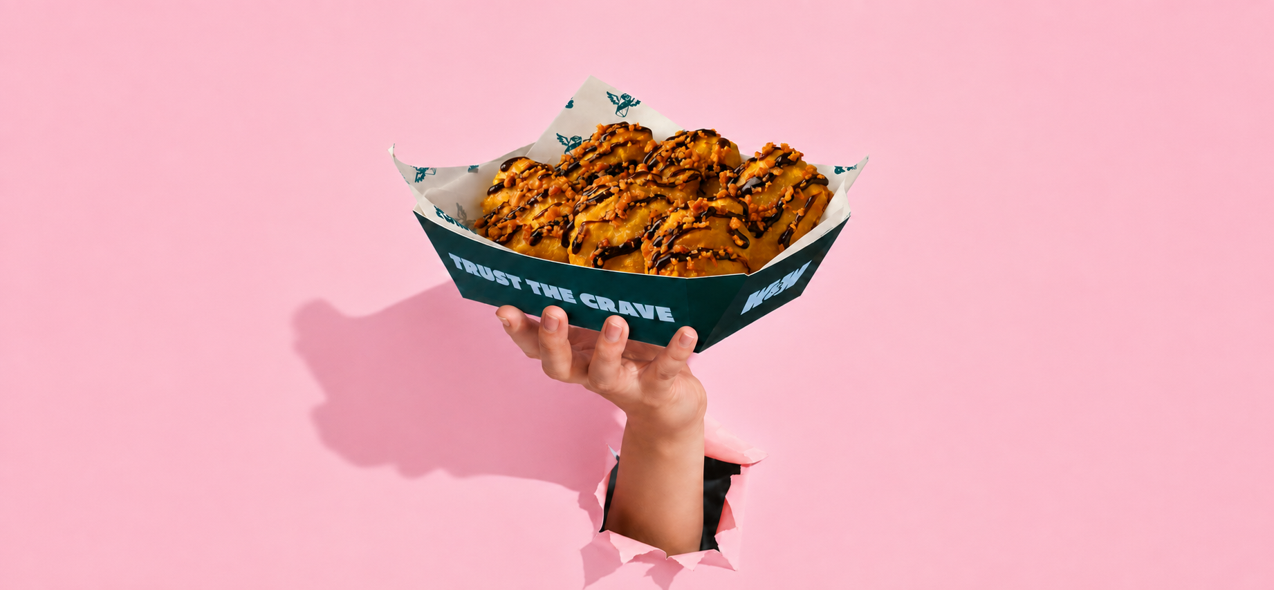 Hand holding Wraps & Wings boneless bites