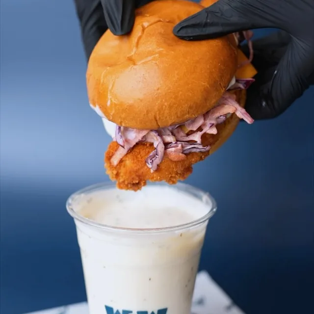 Chicken burger dipped in ranch