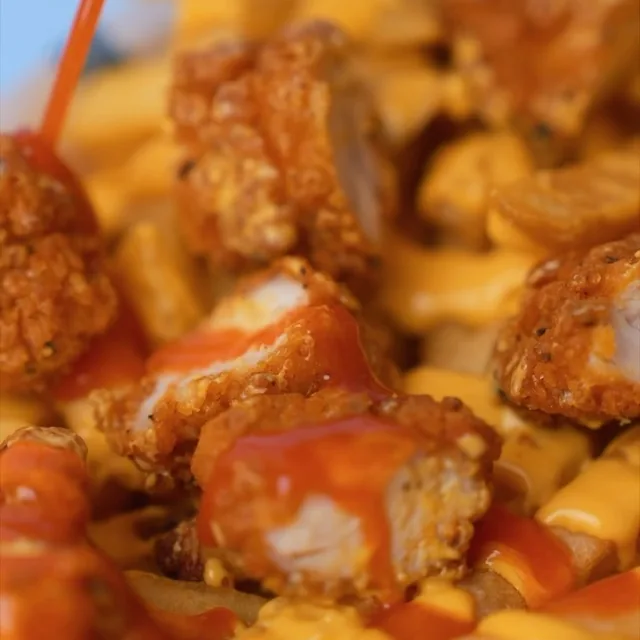 Loaded fries with hot sauce and cheese