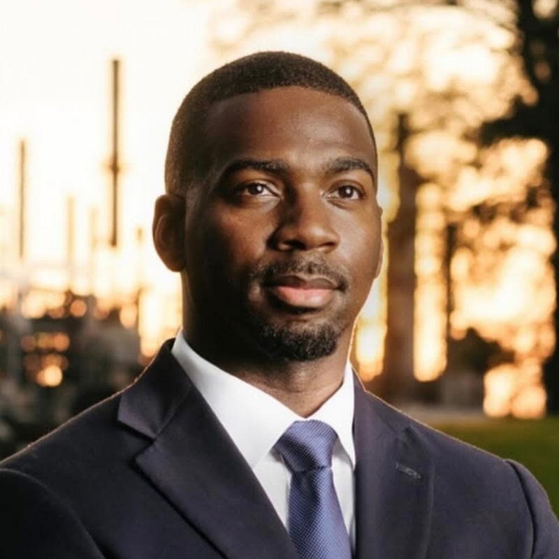 Headshot of KeShaun Pearson with a blurred tree and buildings in the background