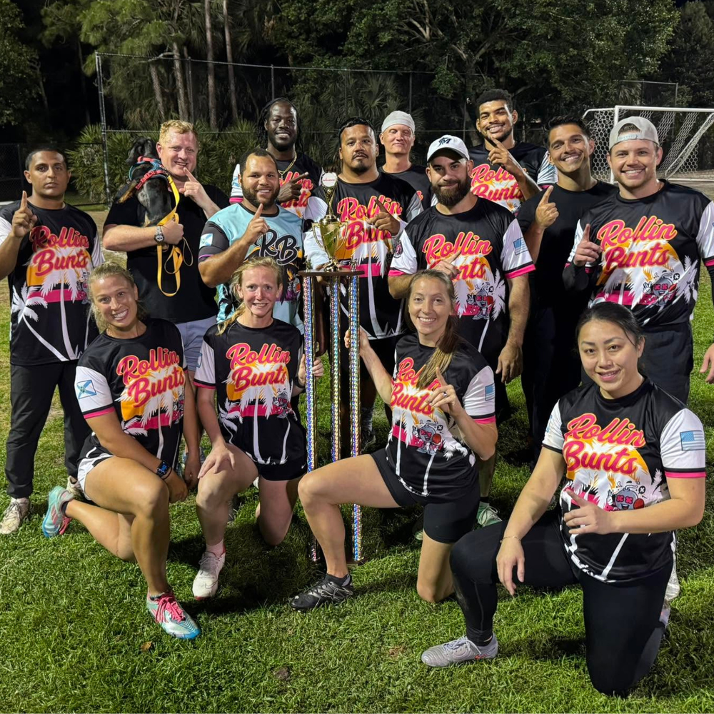 Winning team with large trophy