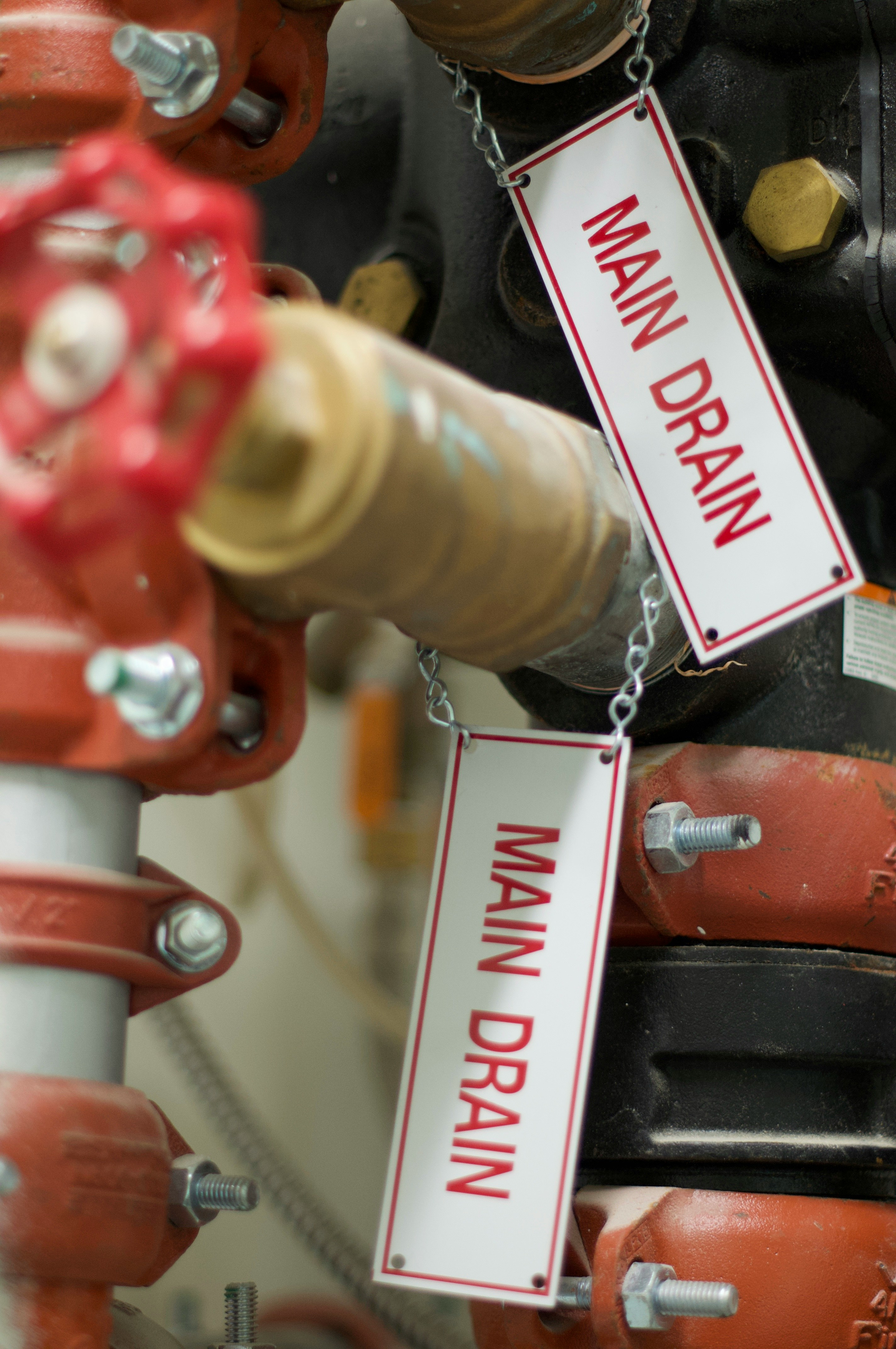 Professional plumber clearing a clogged residential drain.
