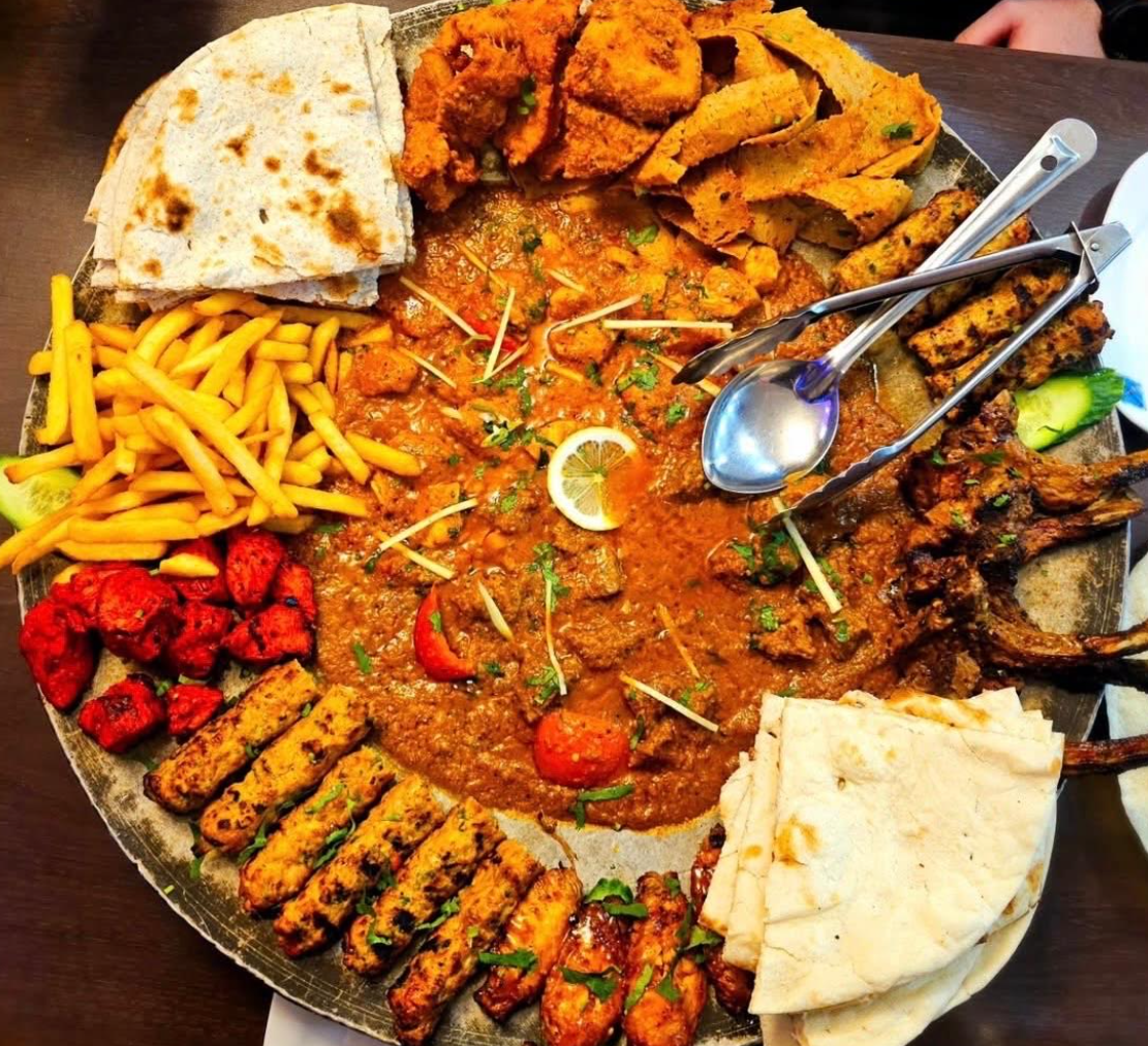 Tawa Mixed Grill platter at Lahore Qila with chops, tikka, kebabs, chips and naan