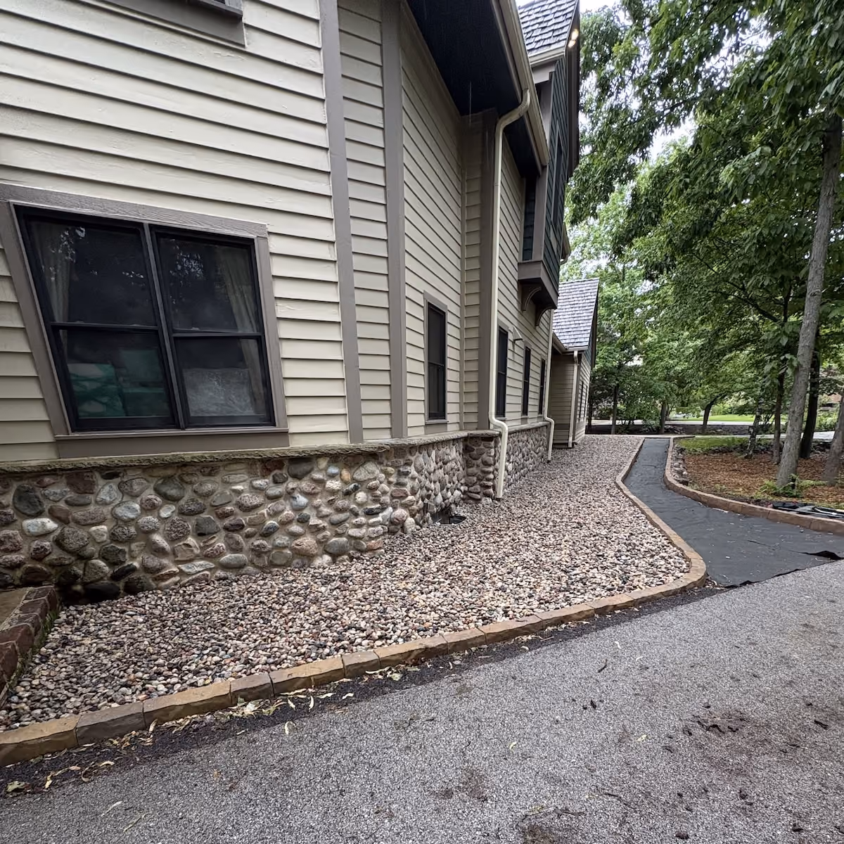 New landscape bed with decorative rock plants and flowers in Southeastern Wisconsin