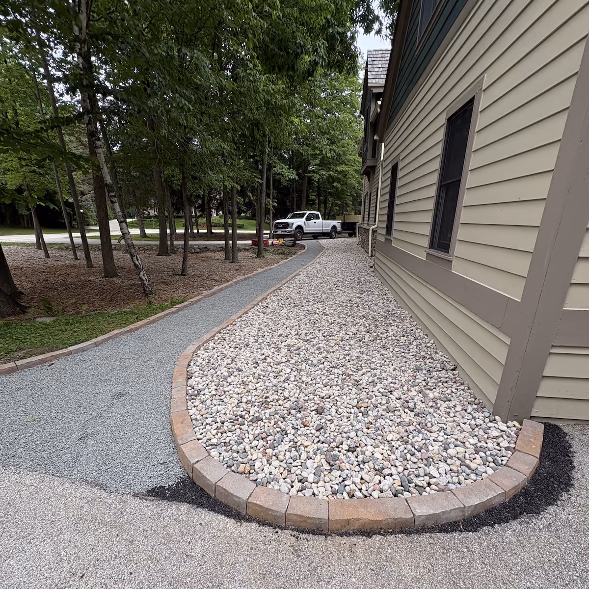 Decorative rock landscape installation by Donath Landscaping Solutions LLC in Southeastern Wisconsin