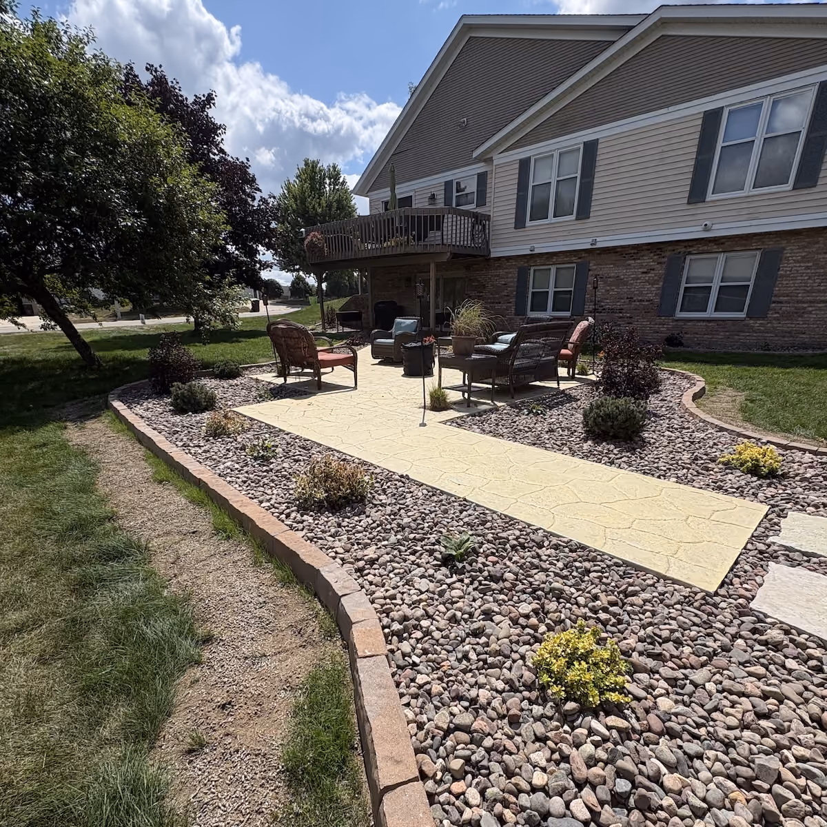 New landscape bed with decorative rock plants and flowers in Southeastern Wisconsin