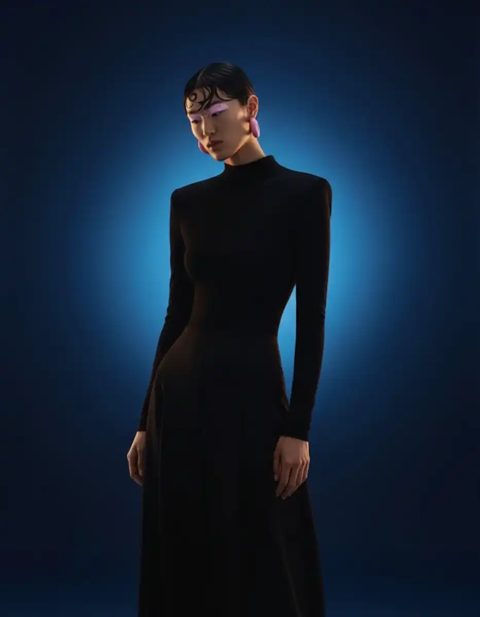Woman in an elegant studio portrait with refined styling.