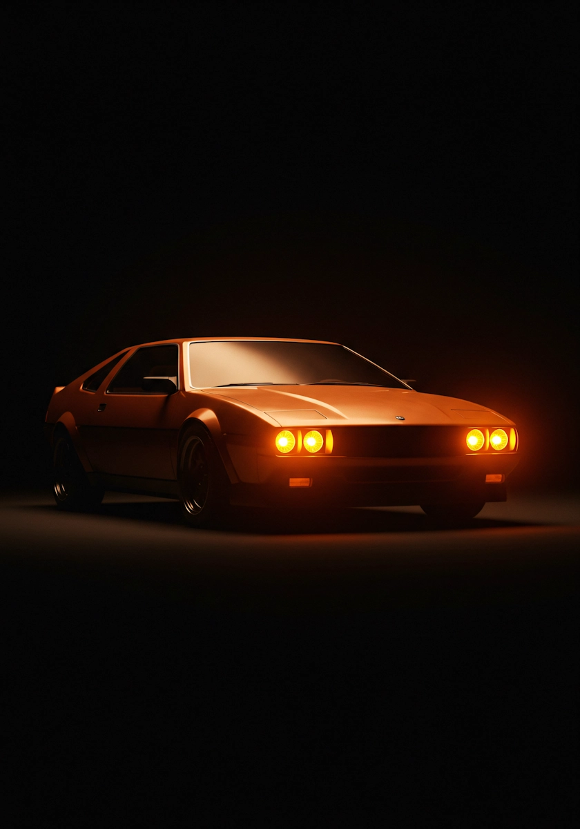 Vintage orange sports car photographed in a stylish setting.