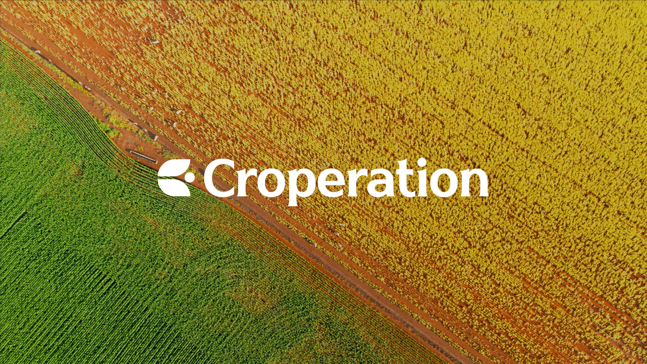 Croperation logo over an aerial view of crop fields