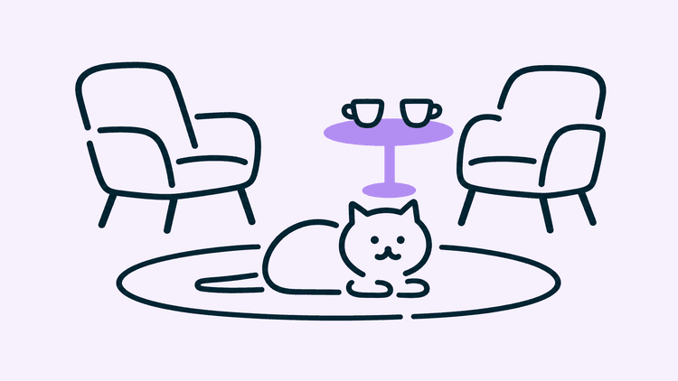A cat lies in a loaf on a rug between two chairs, with a small table and two cups beside it.