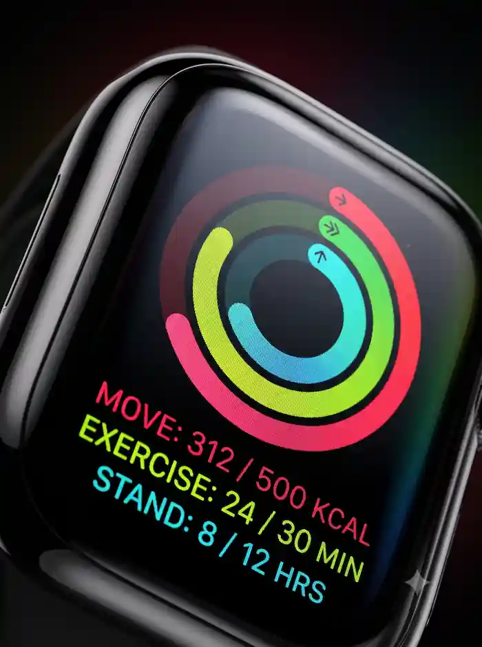 Close-up of Apple Watch screen showing activity rings and stats for move, exercise, and stand goals.
