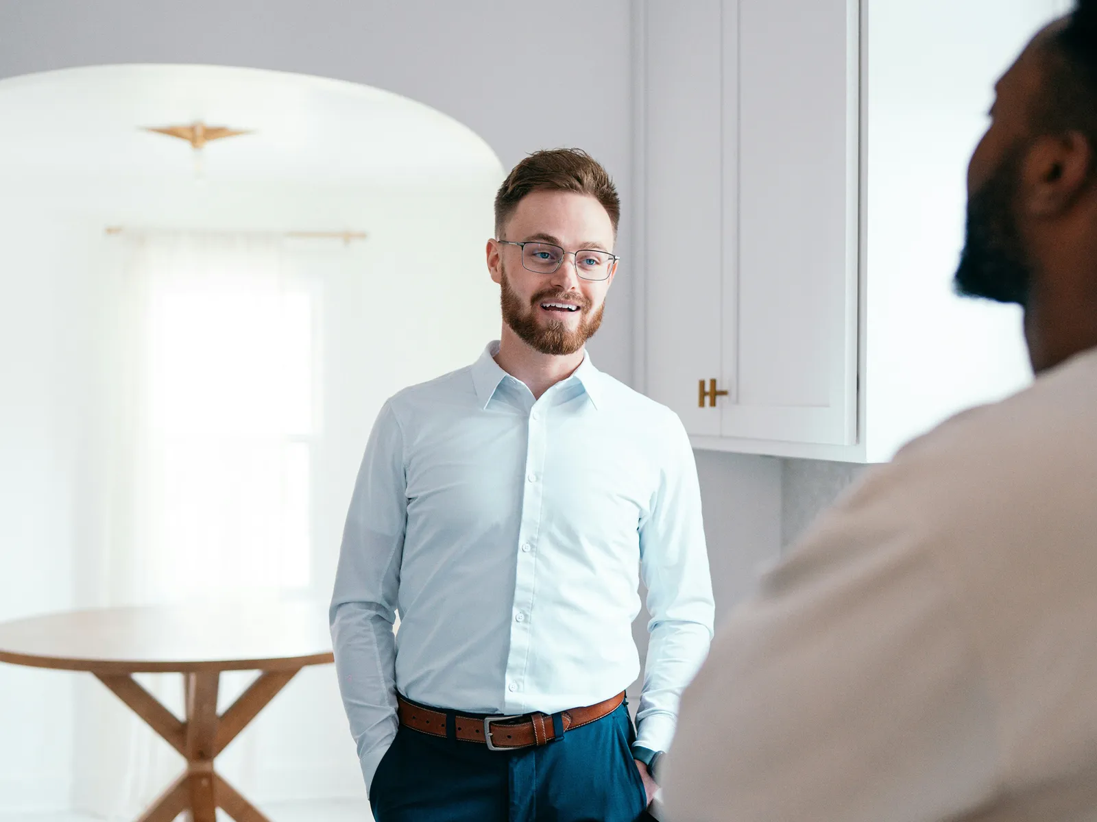 Housing professional speaking with a colleague