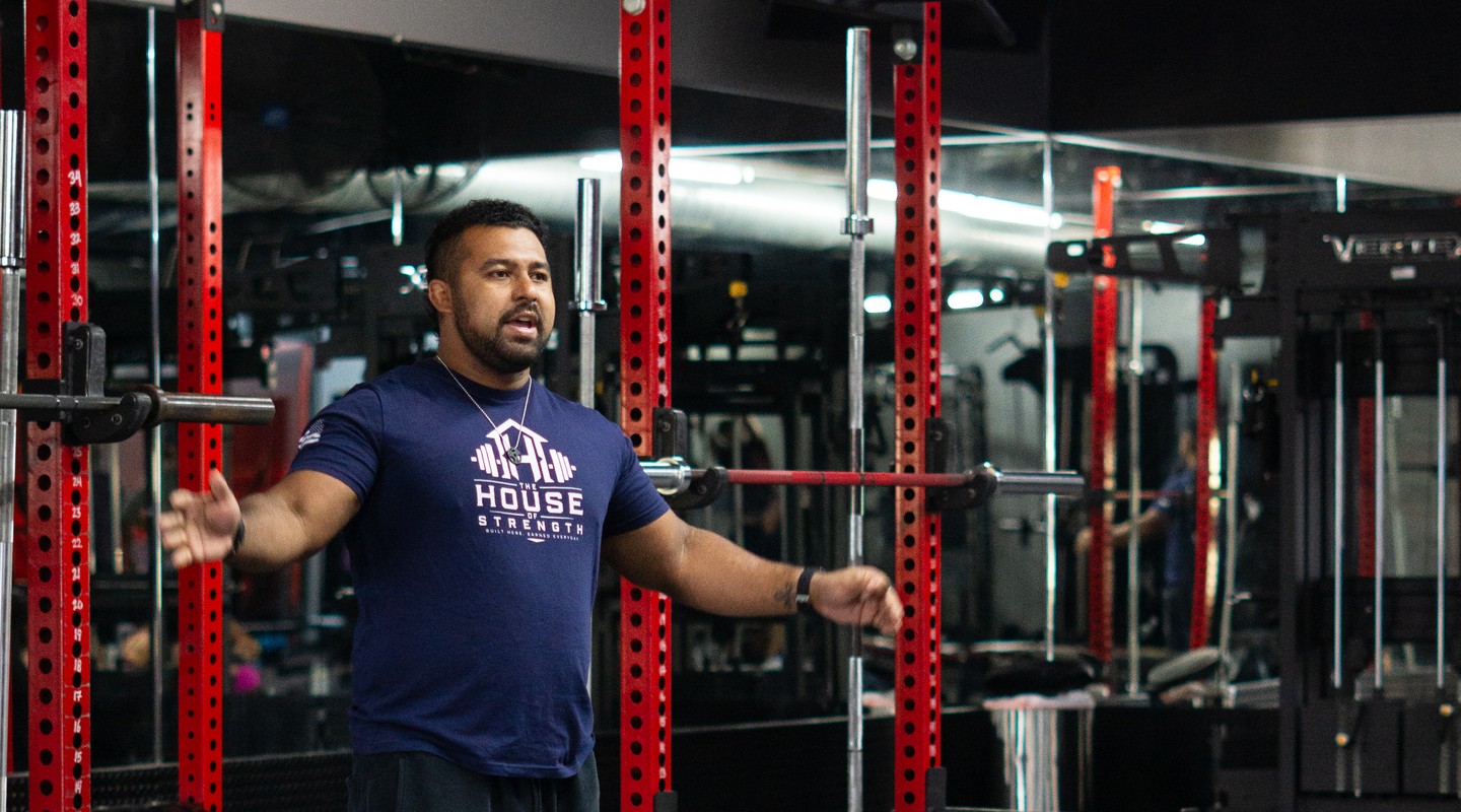 House of Strength coach greeting members in the gym in San Diego, CA.