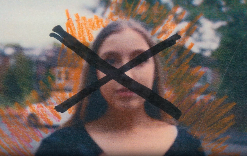 A blurry photograph with a cross in front of it