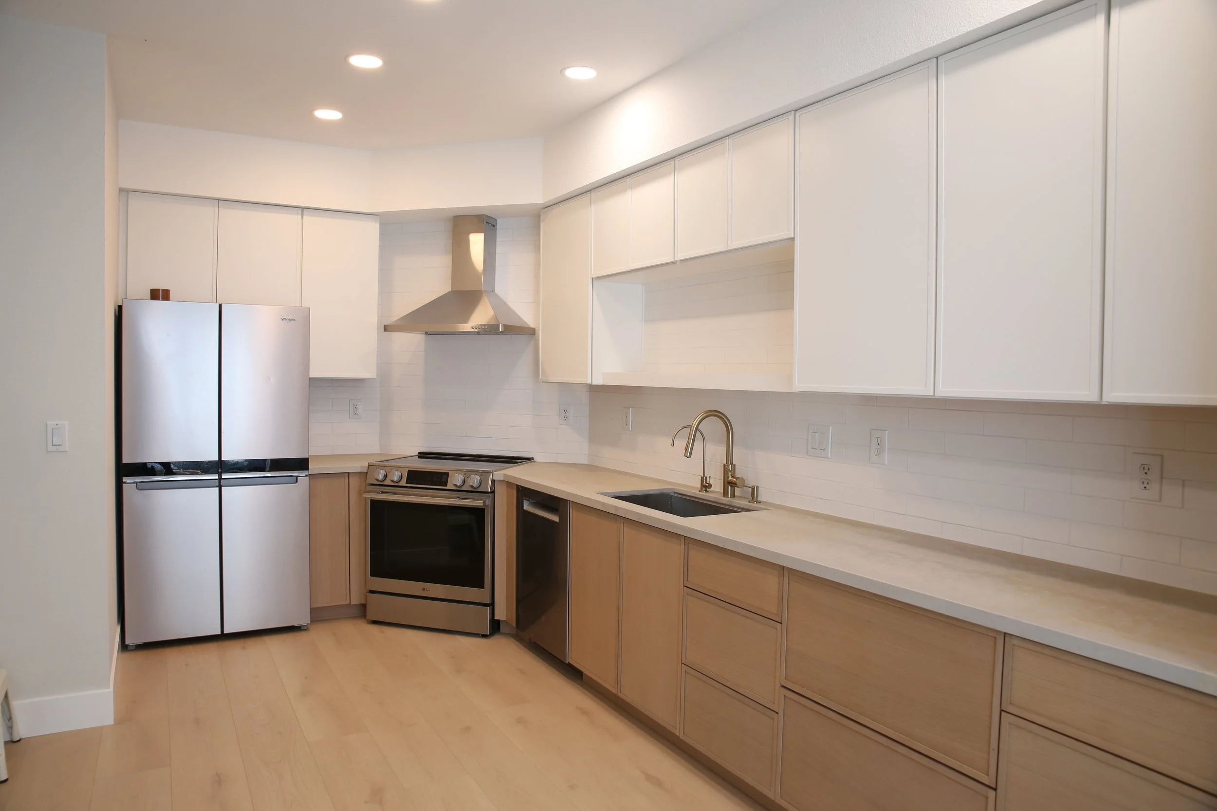 High-end kitchen remodel in Vacaville California with custom cabinetry quartz countertops and large island designed for everyday living
