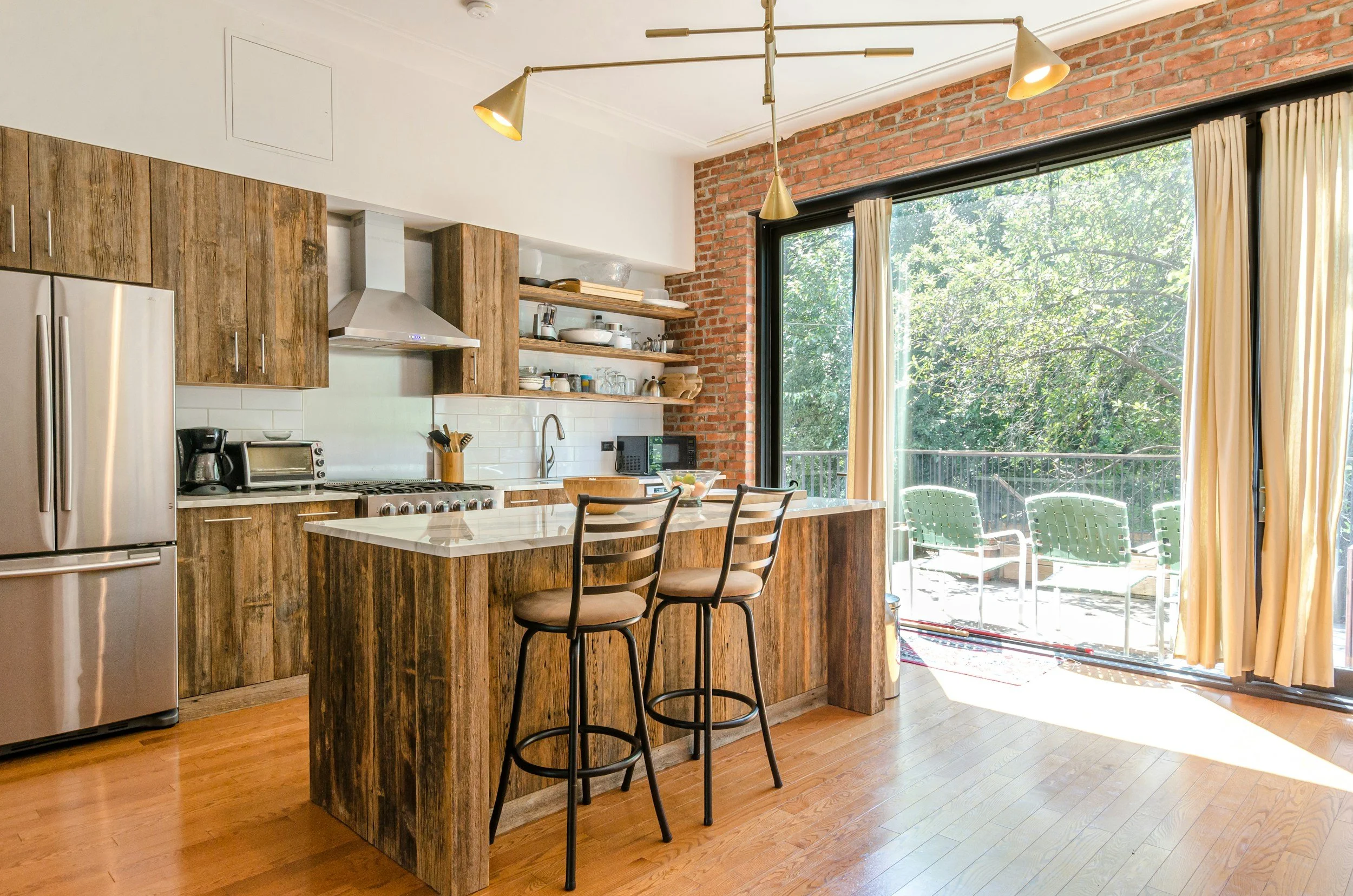 High-end kitchen remodel in Vacaville California with custom cabinetry quartz countertops and large island designed for everyday living