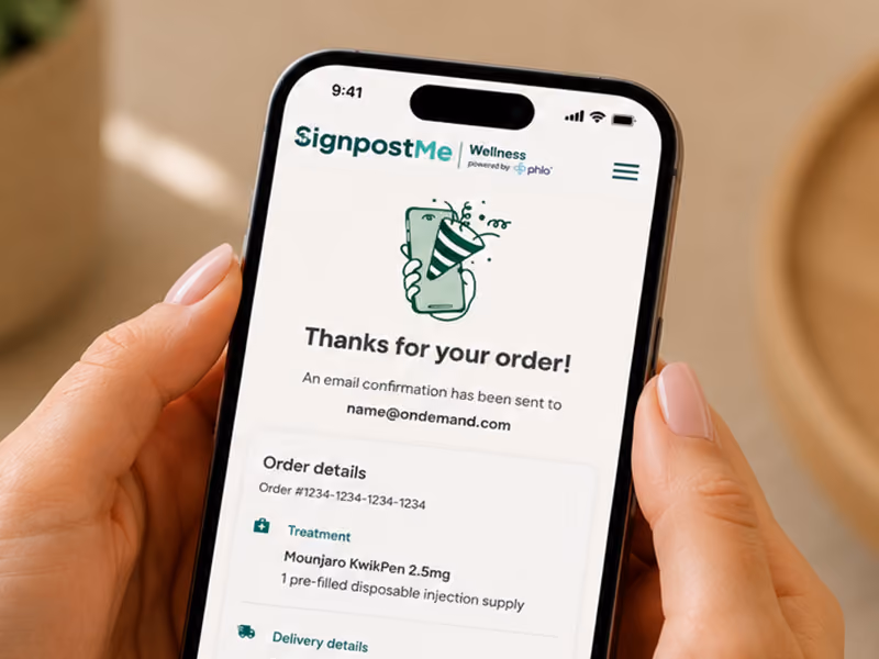 Person holding a smartphone displaying a weight loss order confirmation screen with treatment and delivery details.