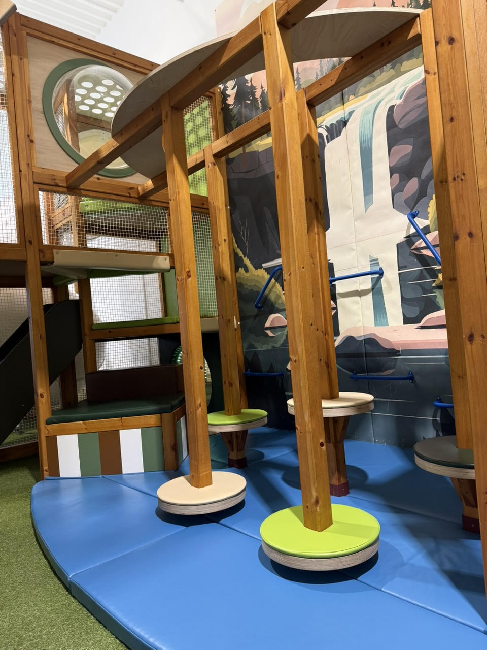 Kids exploring Playful Pines play structures