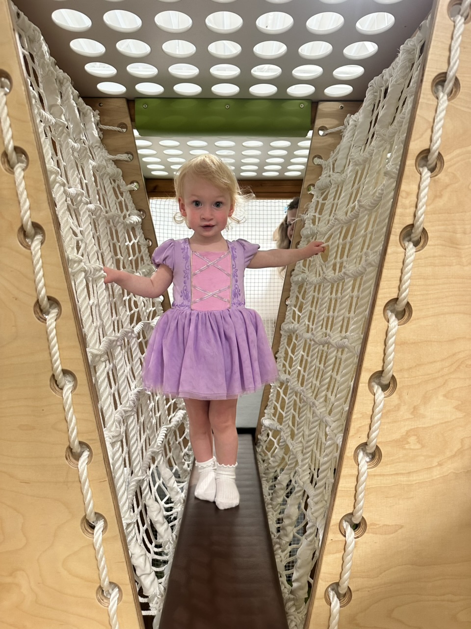Child on rope course at Playful Pines
