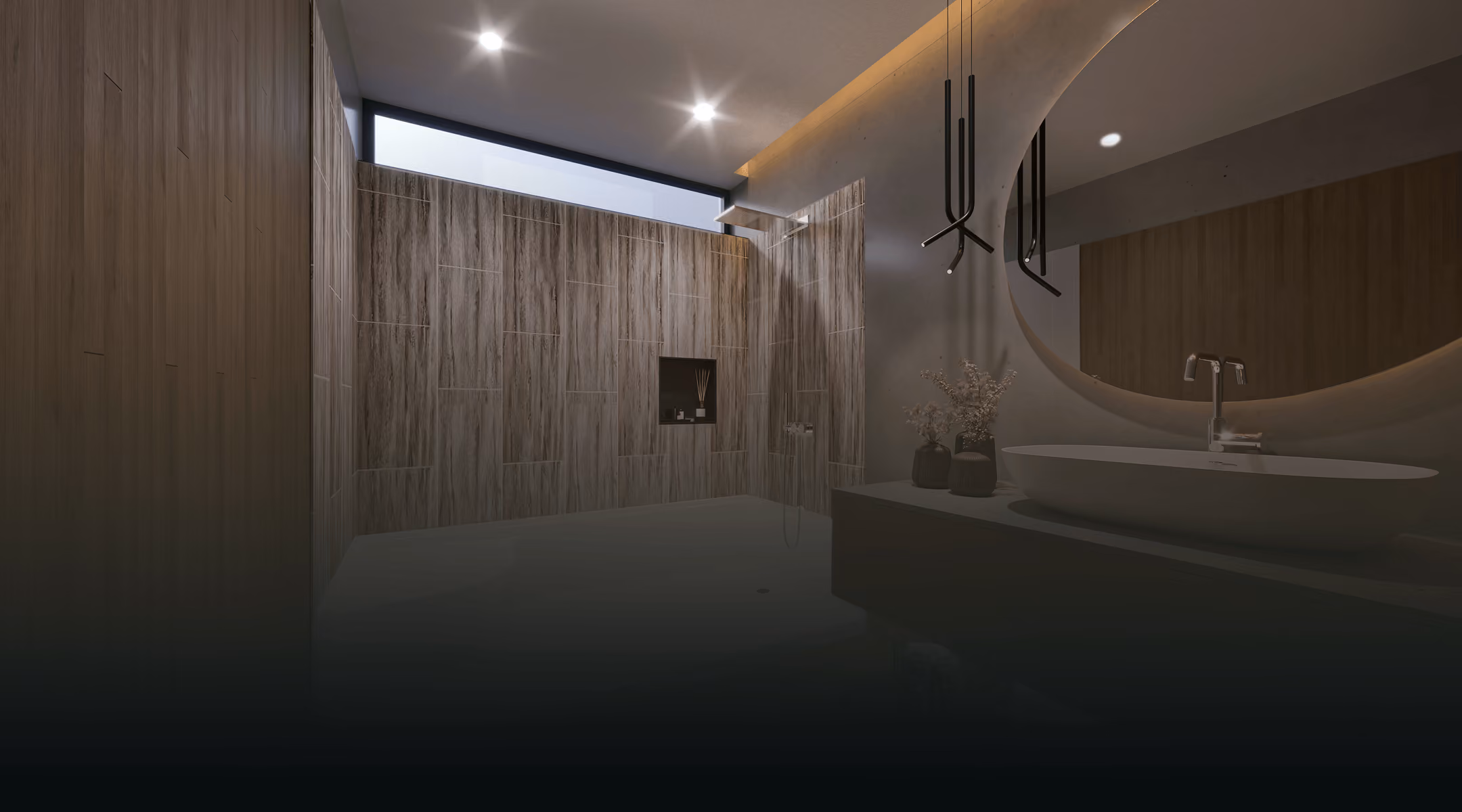 Modern bathroom with wood panel walls, large round mirror, oval sink, and shower area with skylight.