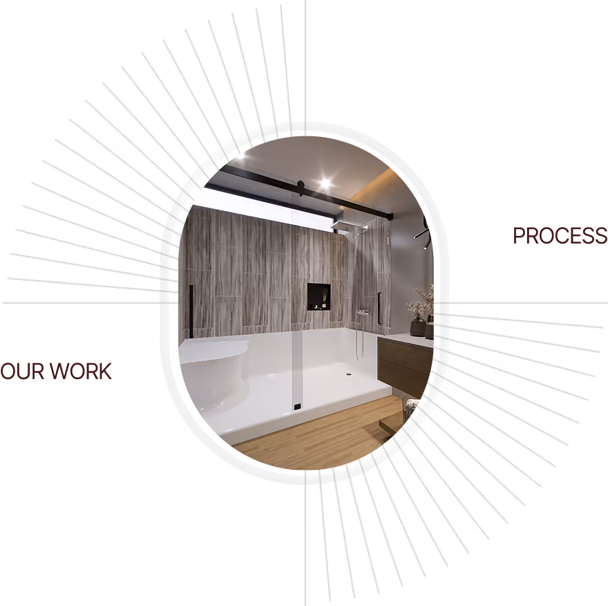 Modern bathroom with a large white tub, glass shower partition, wood floor, and gray tiled wall.