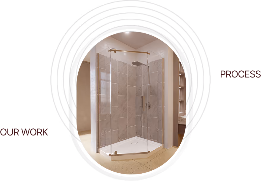 Corner glass shower enclosure with gold hardware and tiled walls inside a modern bathroom