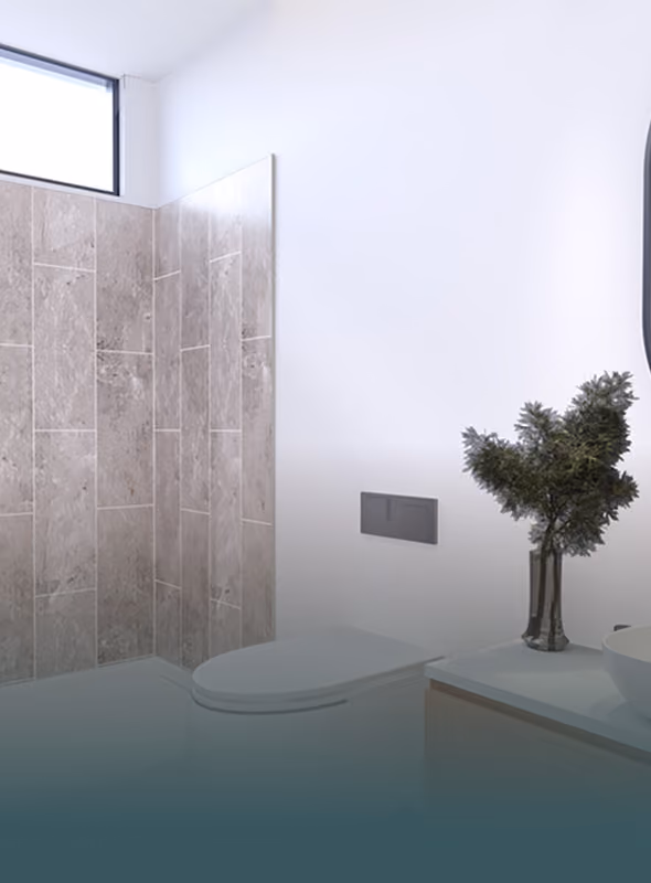 Modern bathroom with a toilet, beige tiled shower, and a vase with green foliage on the counter.