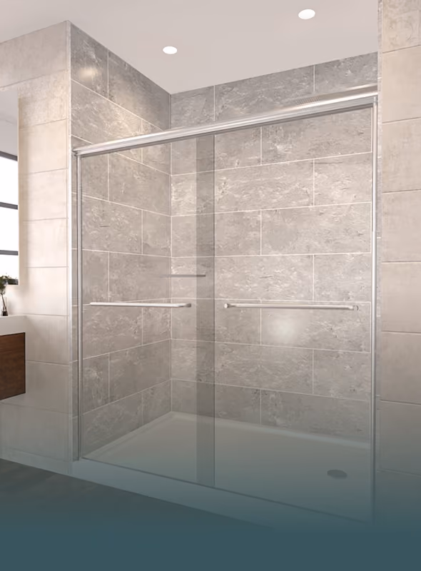Modern shower with sliding clear glass doors and gray tiled walls in a bathroom.