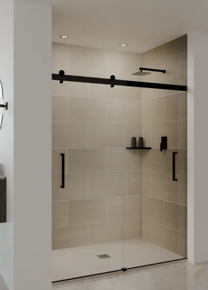Modern walk-in shower with beige tiles, black fixtures, and a glass door with black handles.