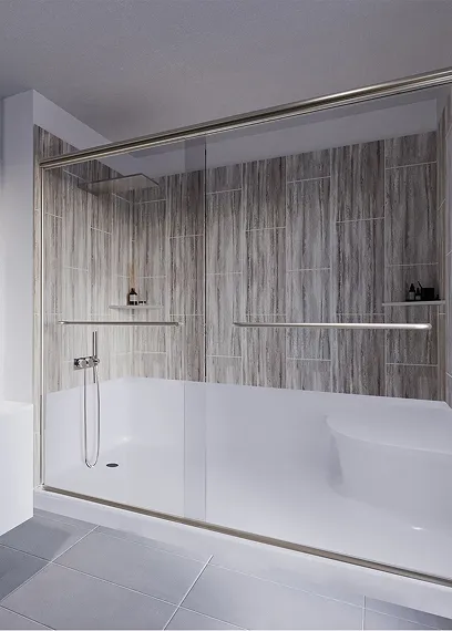 Modern bathtub with glass sliding door and gray wood-patterned tiled wall in bathroom.