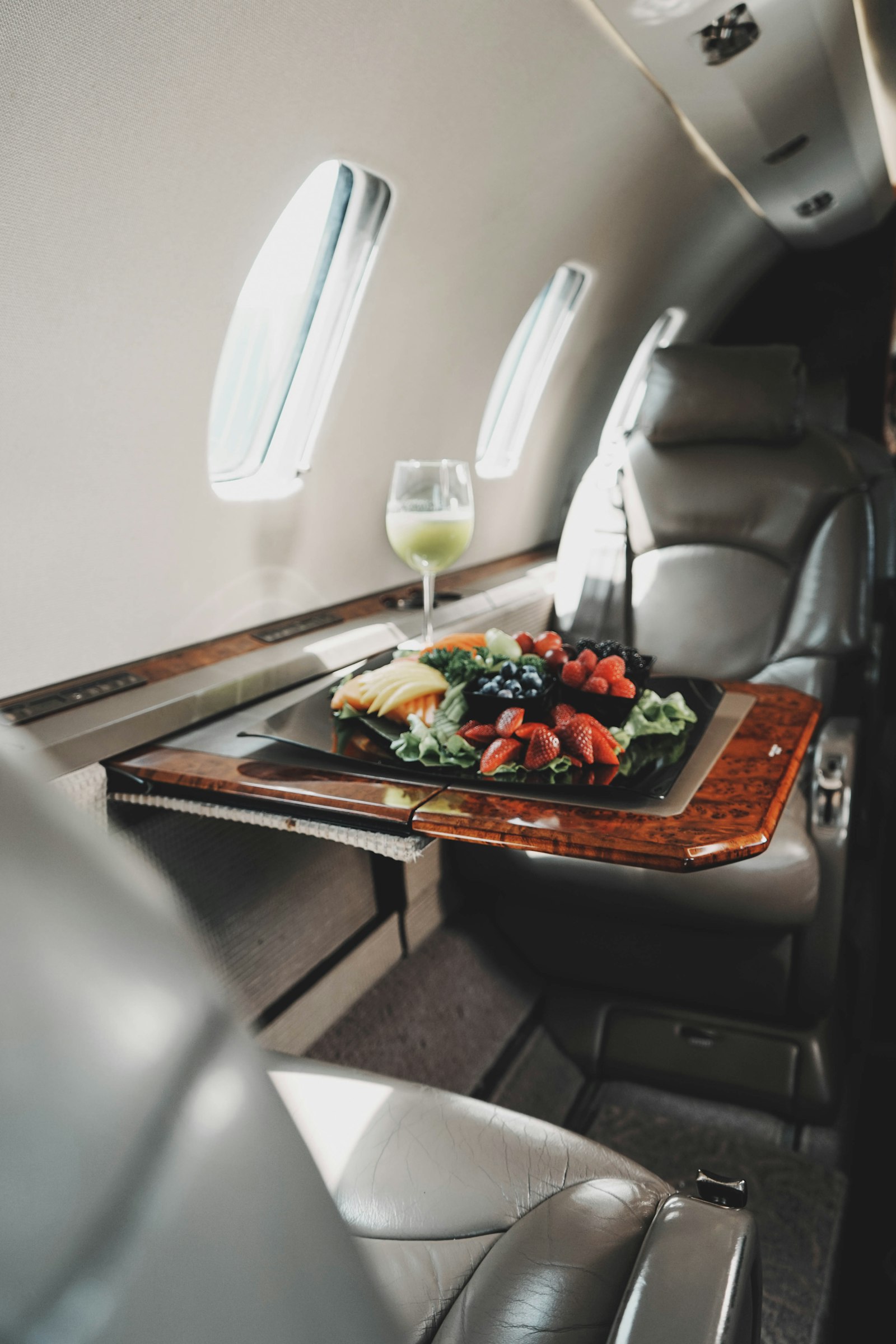Elegant in-flight catering table setting for private jet charter