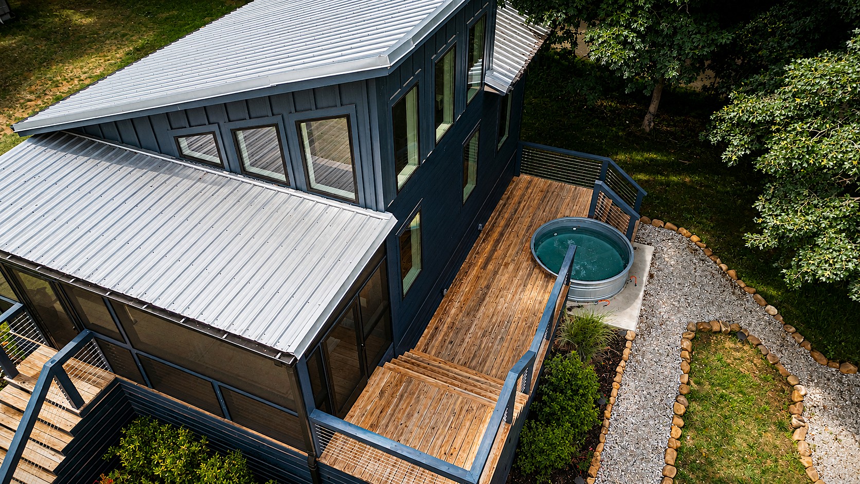 Aerial view of the second-story deck and private stock tank pool at 60 Dwellings Dr, Tracy City TN.