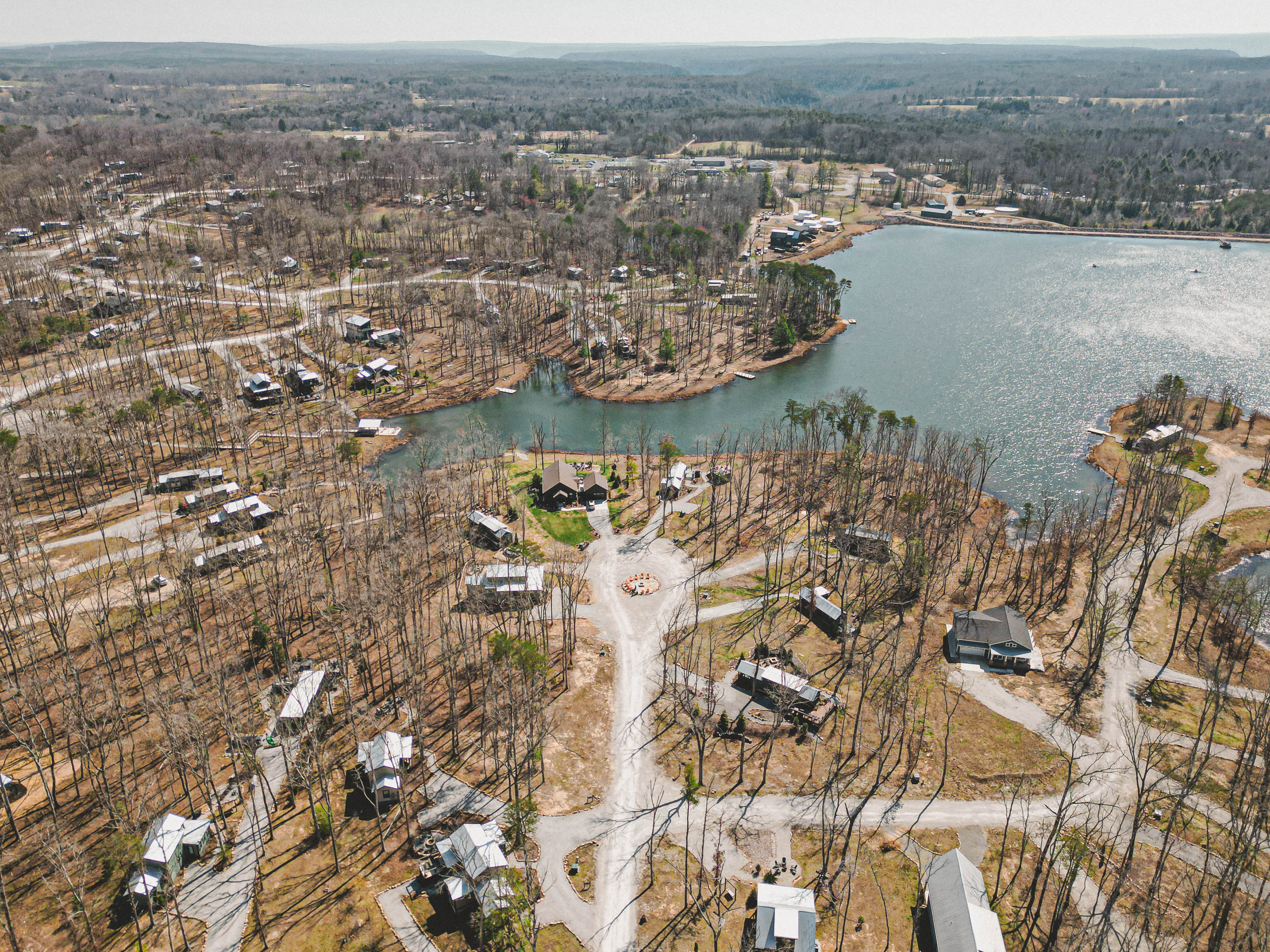 Aerial view of the rolling wooded slope on Lot 85, The Retreat at Water's Edge.