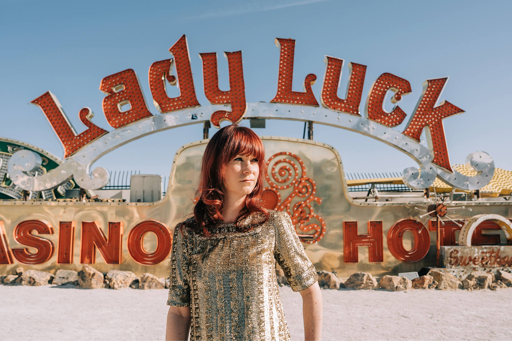 Stephanie Owens in front of the Lady Luck sign in Las Vegas