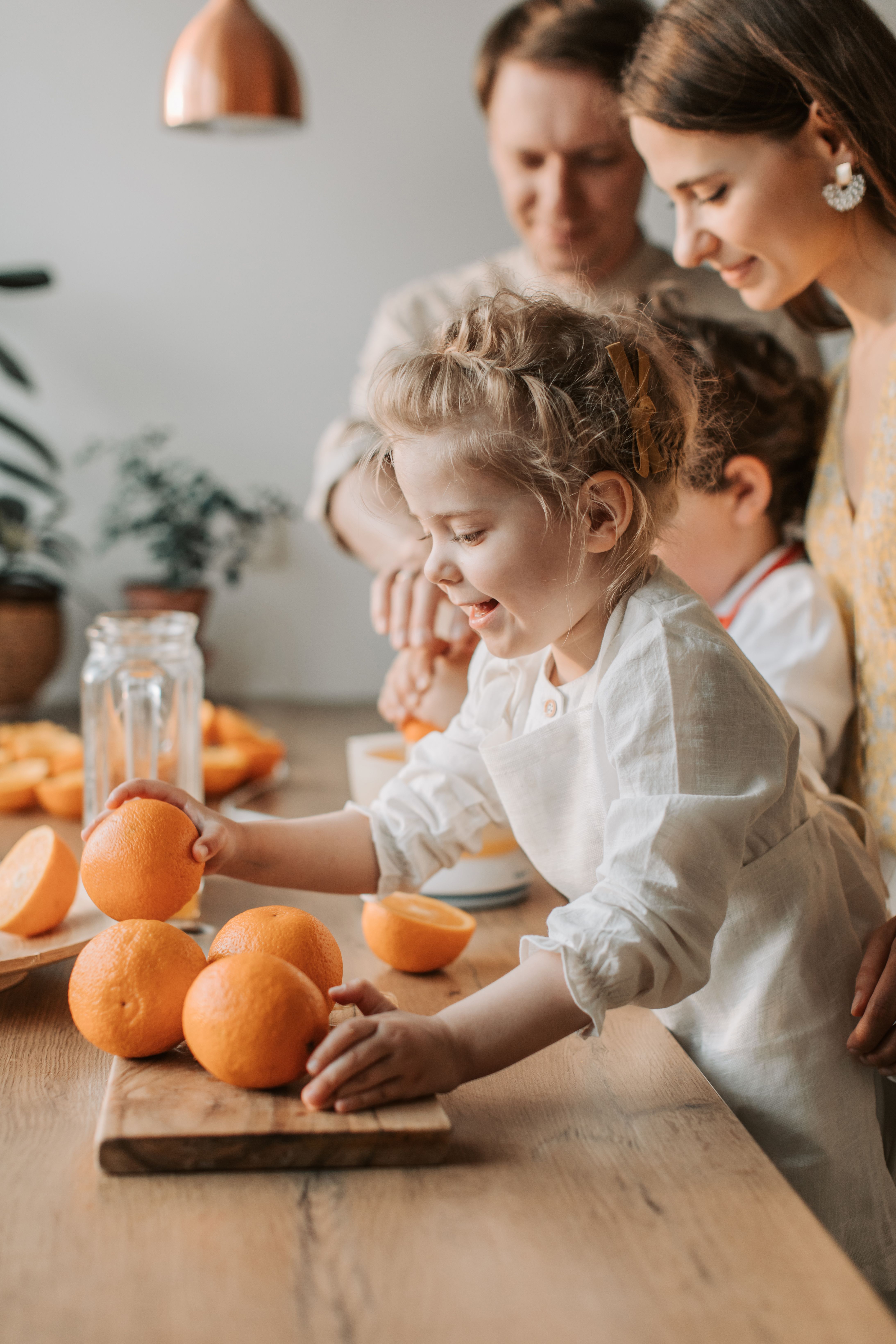 Family holding oranges stock image