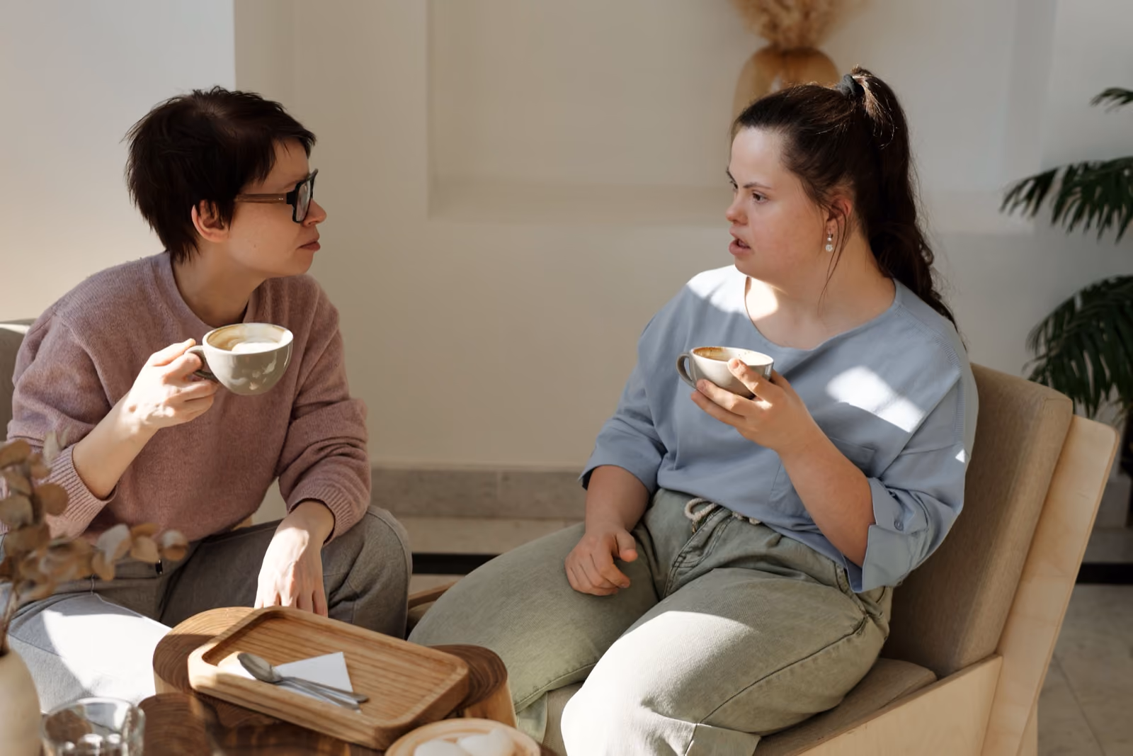Two people sharing coffee, deep in conversation