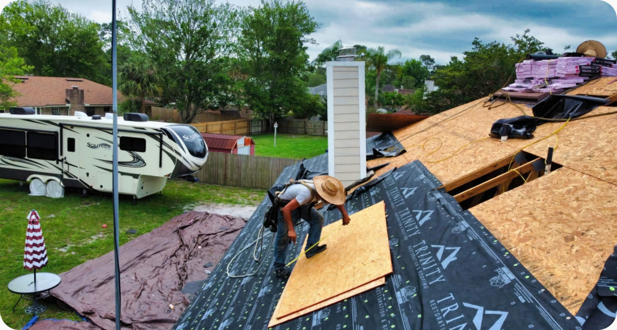 A Trinity crew working on a residential roof replacement