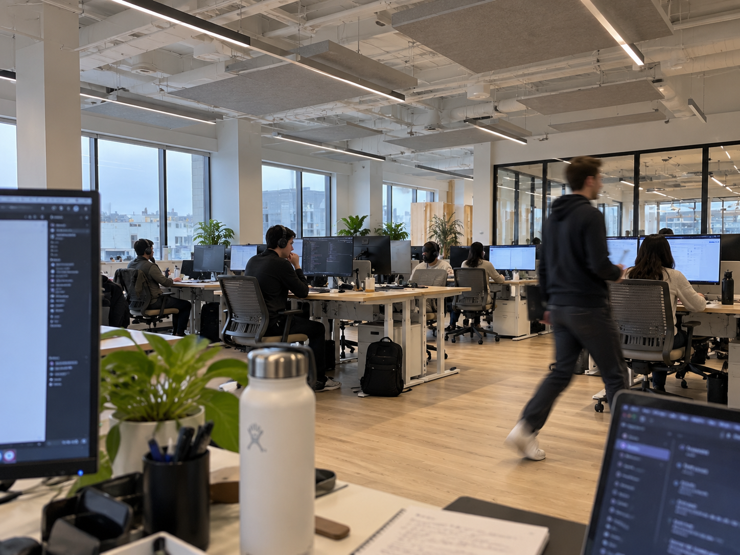 Team meeting around a round table in a modern San Diego office
